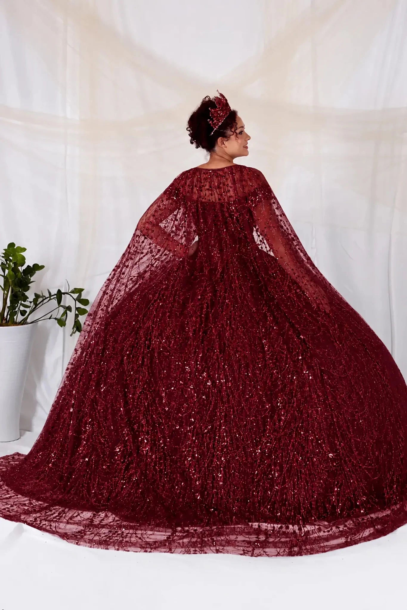 Burgundy sequin quinceanera ball gown with matching cape