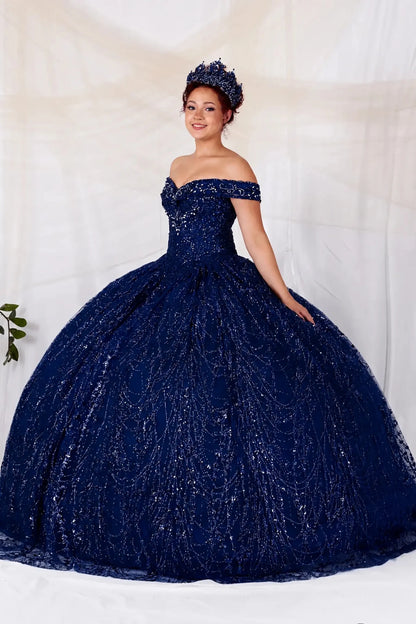 Woman wearing a navy off-shoulder quinceanera ball gown 