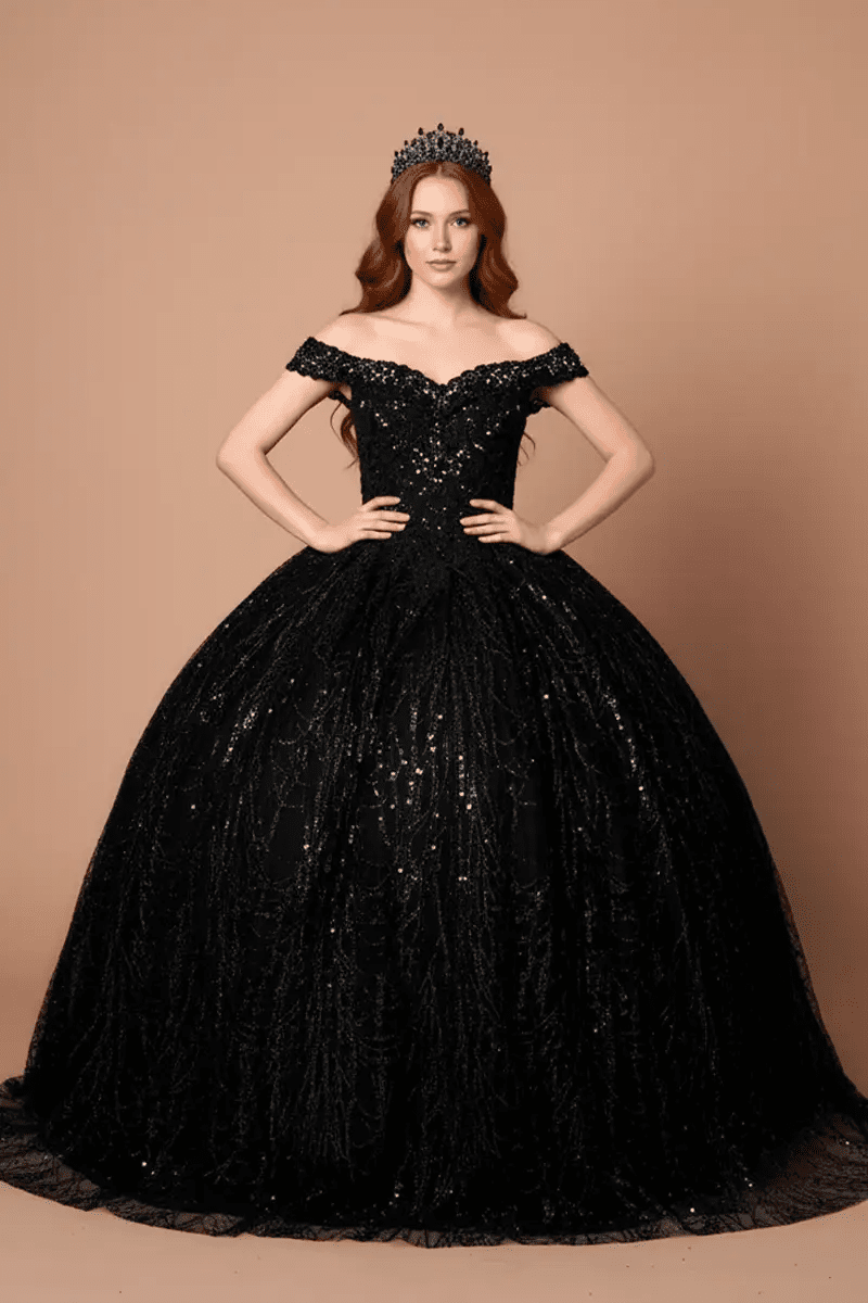 Front-Facing of a woman wearing Black formal gown featuring open back design sweeping hemline and attached cape detail