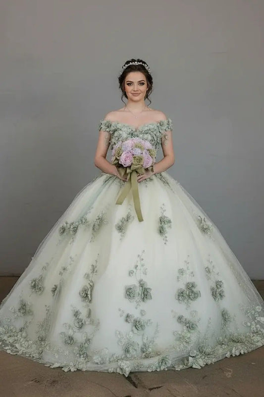Front-Facing of a woman wearing Sage green ball gown with off-shoulder neckline intricate 3D floral appliqués and flowing long train