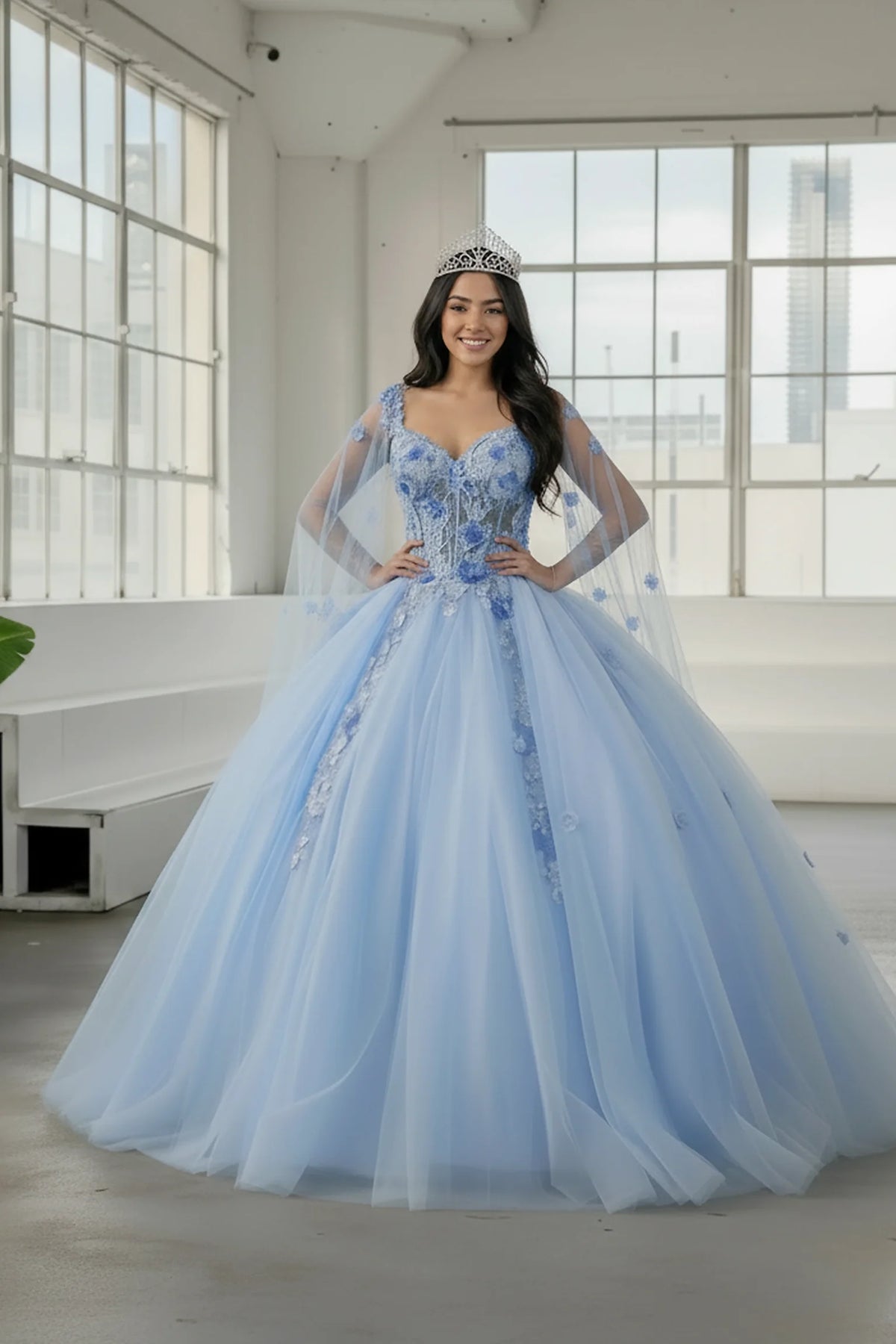 Detachable sheer cape sleeves defines the Light Blue quinceañera dress in this detailed view.