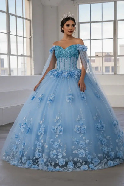 Front-Facing of a woman wearing Light blue ball gown with two-tone design floral embellishment and removable shoulder cape with flowing skirt