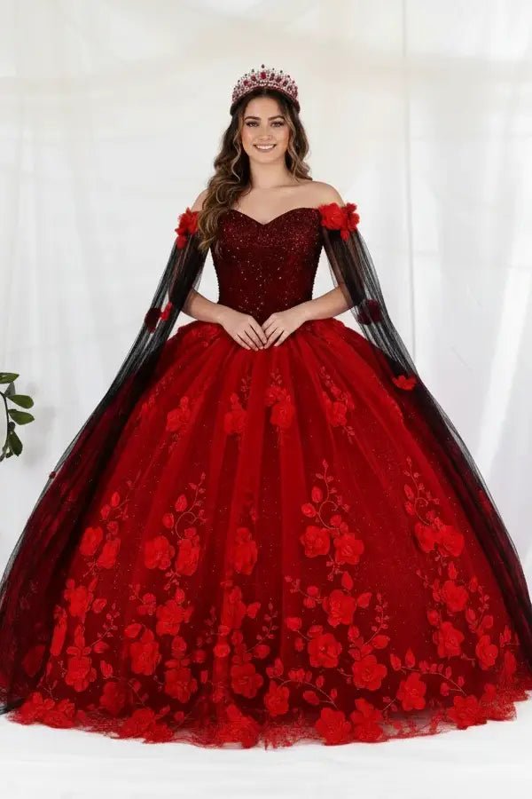 Front-Facing of a woman wearing Red and black ball gown with two-tone design floral embellishments and removable shoulder cape over full skirt