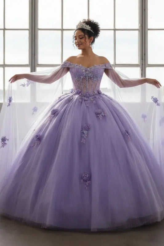 Front-Facing of a woman wearing Lilac quinceanera gown with sheer lace bodice off-shoulder neckline and flowing skirt with removable shoulder cape