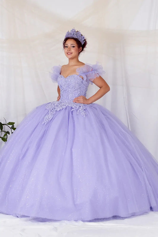 Side View of a woman wearing Purple gown with shimmering beaded bodice layered glitter tulle and removable ruffle sleeves with cape accent