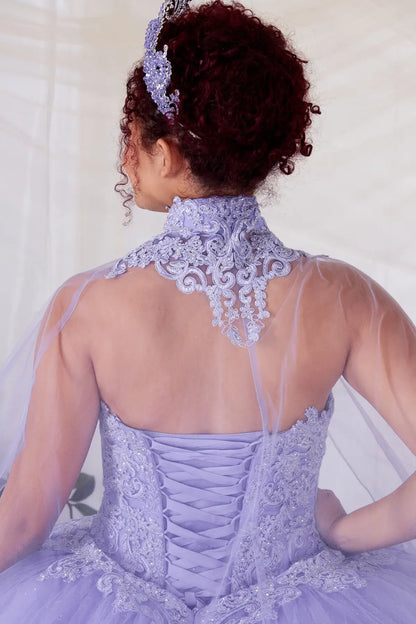Back Close-Up of a woman wearing Back detail of lilac gown showing lace-up finish glitter tulle texture and cape attachment