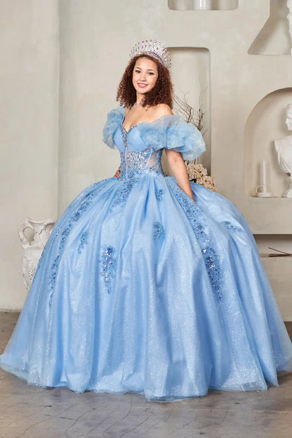 Side View of a woman wearing Soft blue evening dress featuring contoured bodice airy ruffles and elongated A-line silhouette