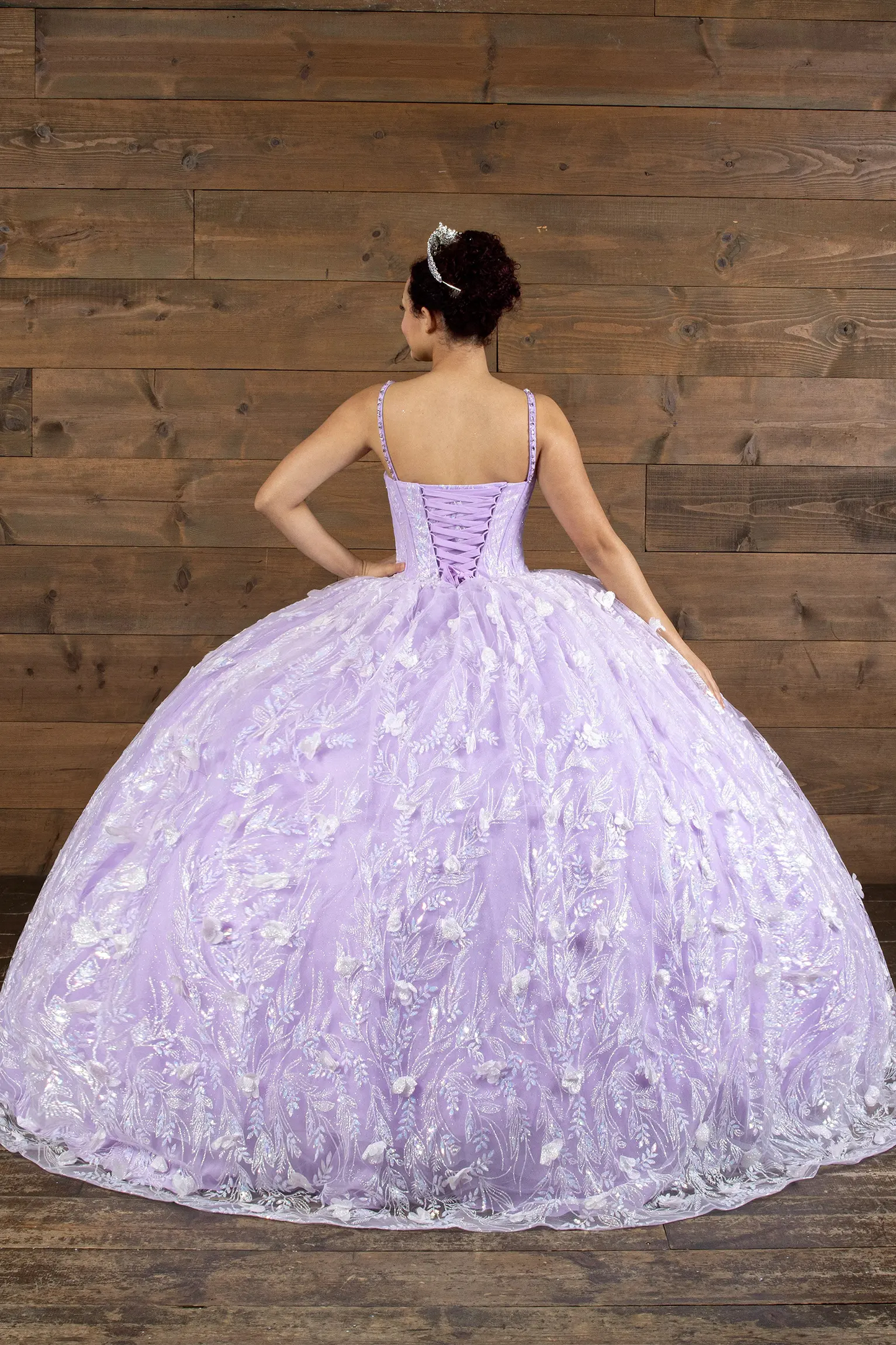 lilac quinceañera dress with a voluminous tulle skir, floral applique and lace up back