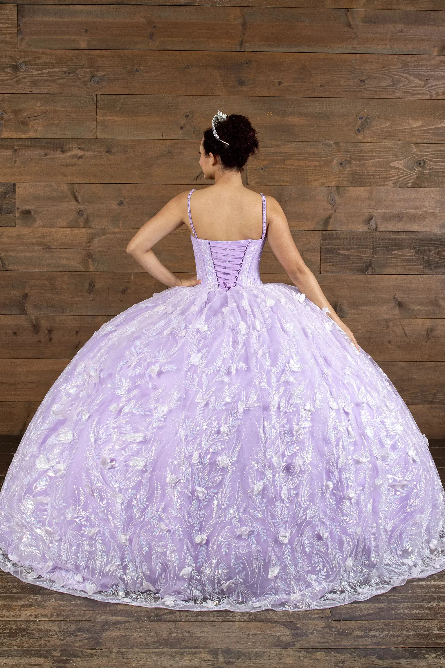 lilac quinceañera dress with a voluminous tulle skir, floral applique and lace up back