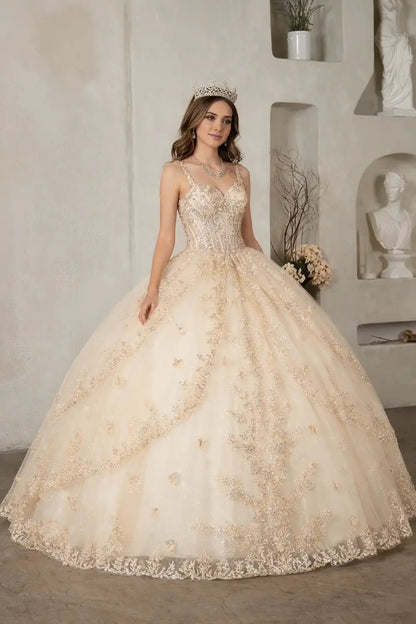 Front-Facing of a woman wearing Champagne ball gown with spaghetti straps sheer bodice 3D butterfly accents and multi-layer lace skirt
