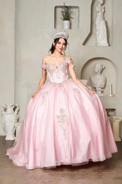 Front-Facing of a woman wearing Blush ball gown with sheer sweetheart neckline off-shoulder bodice floral embroidery and layered glitter tulle skirt