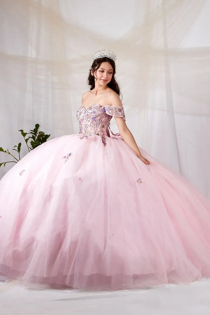 Side View of a woman wearing Soft pink gown with multicolor floral bodice contoured waist and full glitter tulle skirt