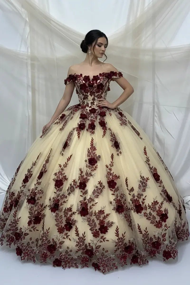 Front-Facing of a woman wearing Champagne and navy ball gown with two-tone design off-shoulder floral bodice and intricate 3D flower appliqués over a voluminous skirt