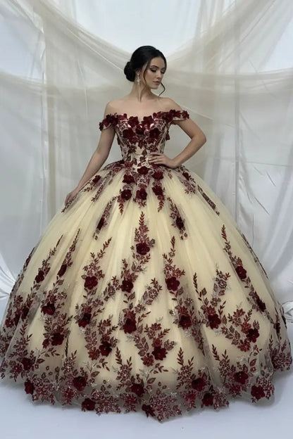 Front-Facing of a woman wearing Champagne and navy ball gown with two-tone design off-shoulder floral bodice and intricate 3D flower appliqués over a voluminous skirt