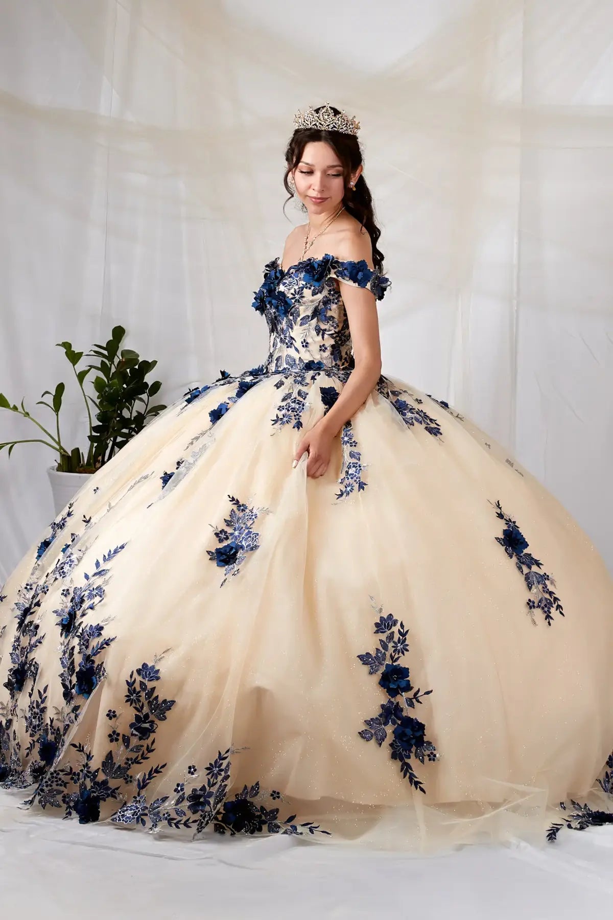 Side View of a woman wearing Two-tone gown with floral bodice dimensional appliqués and flowing skirt design