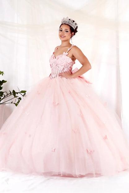 Side View of a woman wearing Soft pink gown with sheer bodice butterfly embellishments and layered airy skirt