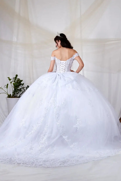 Back-Facing of a woman wearing White formal gown featuring bow detail trailing skirt and soft silhouette
