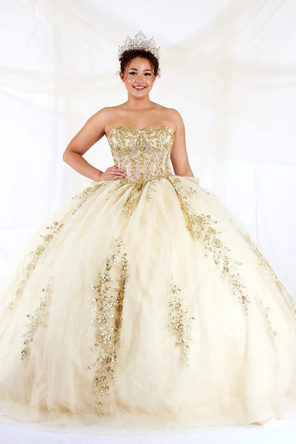 Front-Facing of a woman wearing Champagne ball gown with sheer sweetheart neckline off-shoulder bodice floral appliques and layered embroidered glitter tulle skirt with bow detail