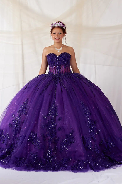 Front-Facing of a woman wearing Purple strapless ball gown with structured bodice lace appliqué beading and voluminous glitter tulle skirt