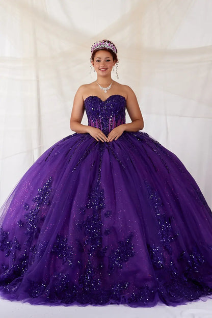 Front View of a woman wearing Rich purple gown with lace detailing beaded bodice and airy skirt design