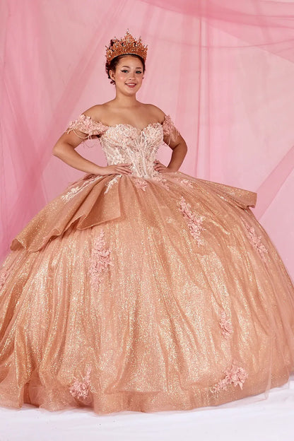 Front View of a woman wearing Soft metallic tone gown with embroidered bodice fringe straps and voluminous layered skirt