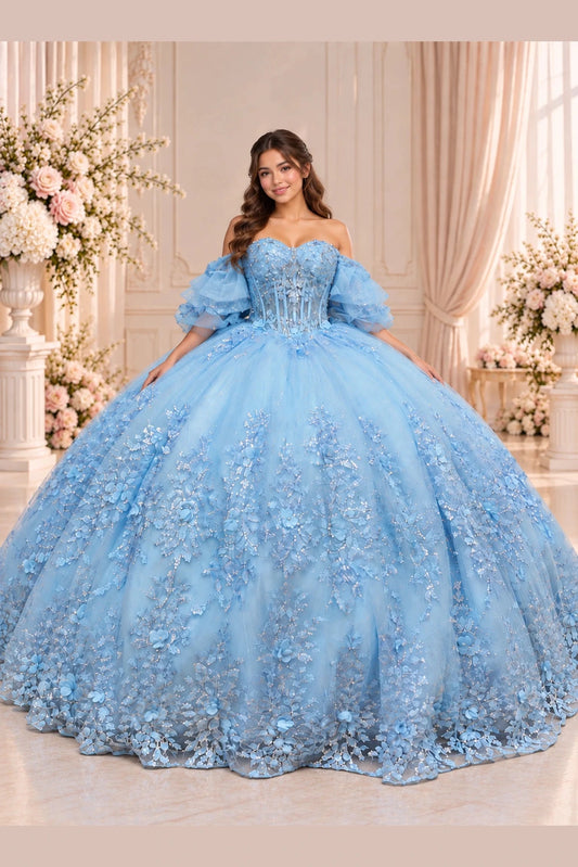 Bahama Blue quinceañera dress with floral appliqués cascading over a full skirt and softly ruffled sleeves.