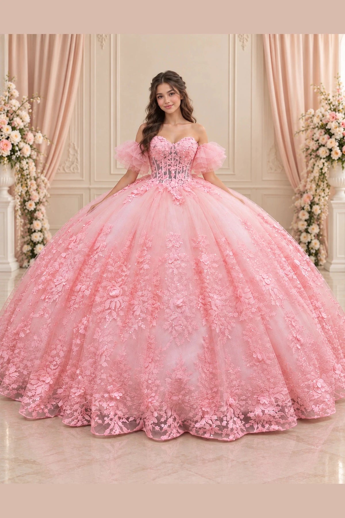 Blush Pink (Blush/Pink) quinceañera dress with floral appliqués cascading over a full skirt and softly ruffled sleeves.