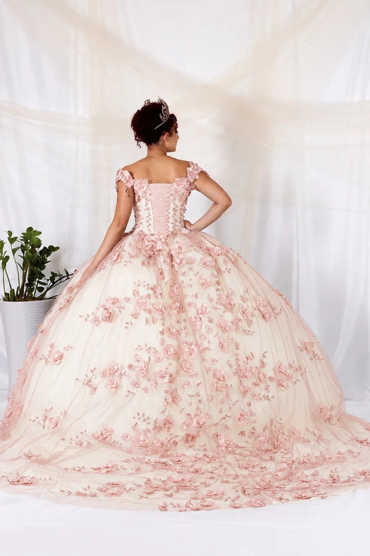 Bodice close-up highlights pink quinceañera ball gown with off‑shoulder neckline, 3D floral applique and long train.