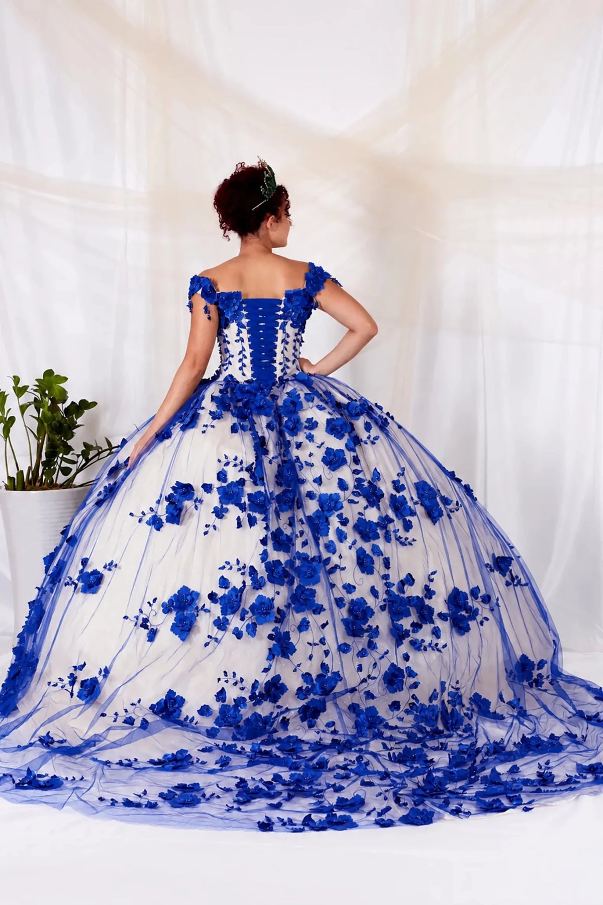 Royal blue quinceañera ball gown with off‑shoulder neckline, 3D floral applique and long train
