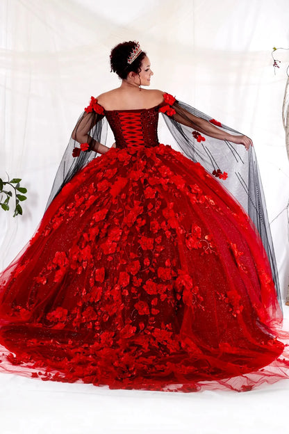 Back-Facing of a woman wearing Two-tone formal gown featuring layered skirt open back and detachable cape detail