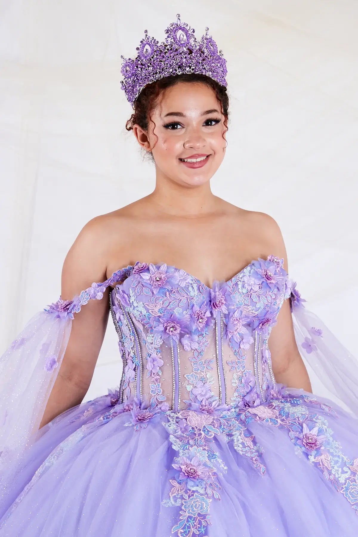 Lilac quinceañera ball gown with sheer lace bodice and detachable cape