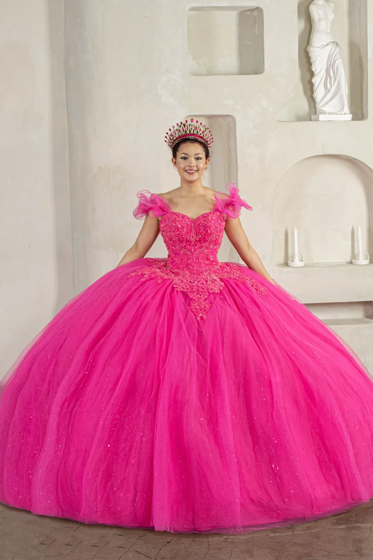 Fuchsia quinceañera ball gown with removable ruffle sleeves, beaded bodice, glitter tulle skirt and cape