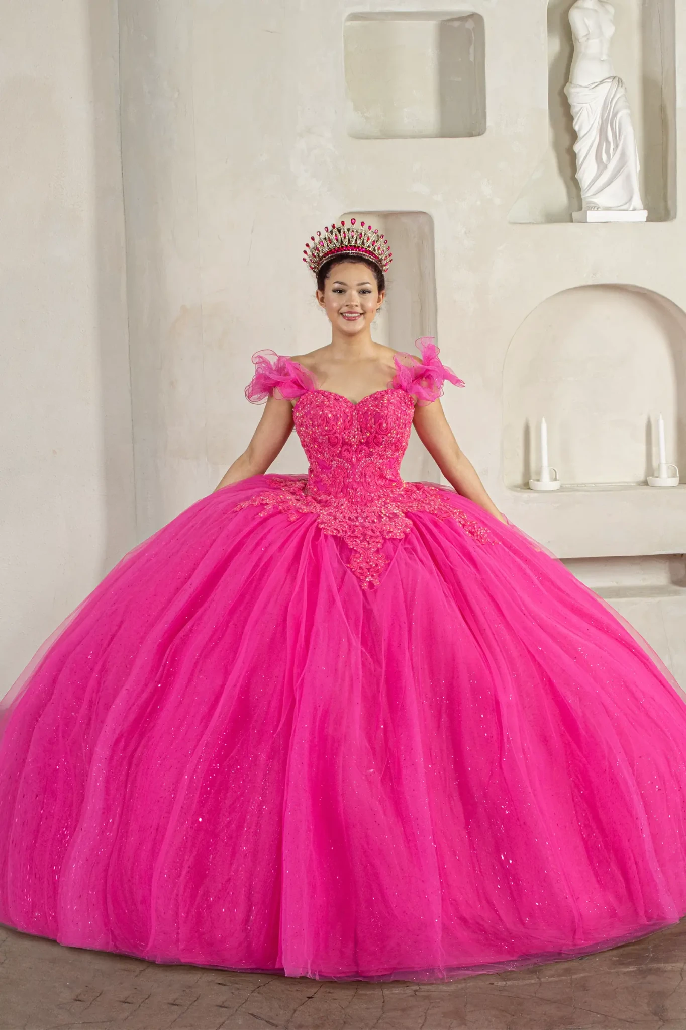 Fuchsia quinceañera ball gown with removable ruffle sleeves, beaded bodice, glitter tulle skirt and cape