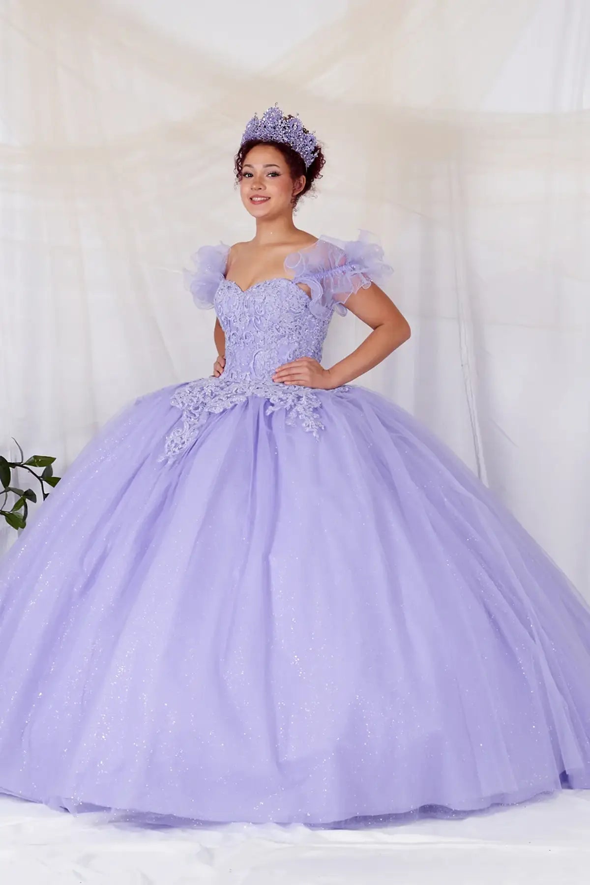 Lilac quinceañera ball gown with removable ruffle sleeves, beaded bodice, glitter tulle skirt and detachable cape
