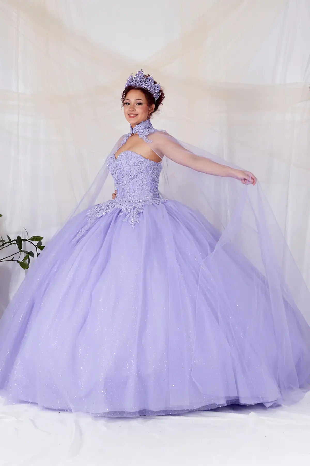 Lilac quinceañera ball gown with removable ruffle sleeves, beaded bodice, glitter tulle skirt and detachable cape