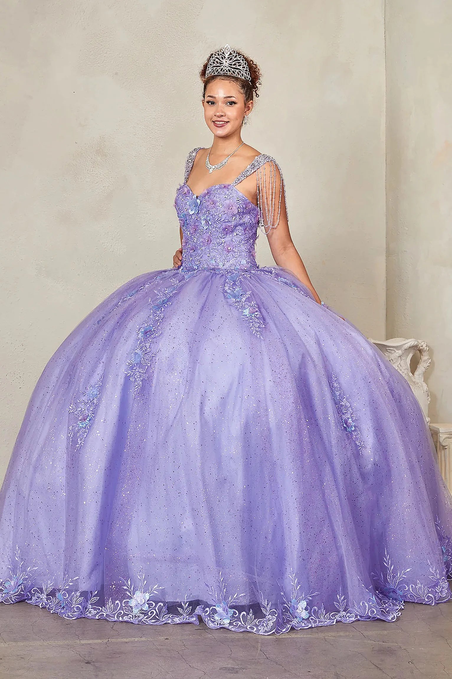 Lilac quinceañera ball gown with sweetheart corset bodice framed by bead-fringed cap sleeves