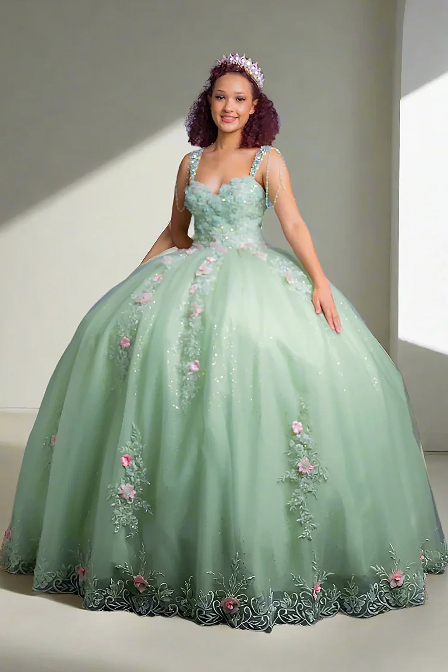 Sage quinceañera ball gown featuring 3D floral appliqués blooming along the glitter tulle skirt