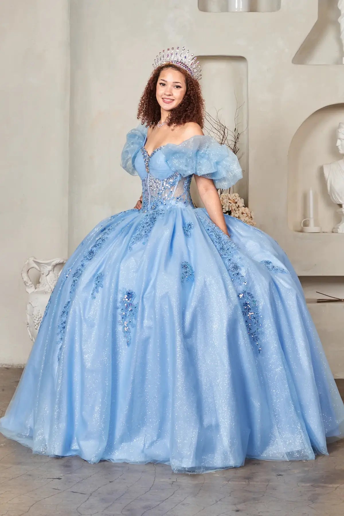 Light blue quinceañera ball gown with illusion corset bodice, ruffled straps and sweep train