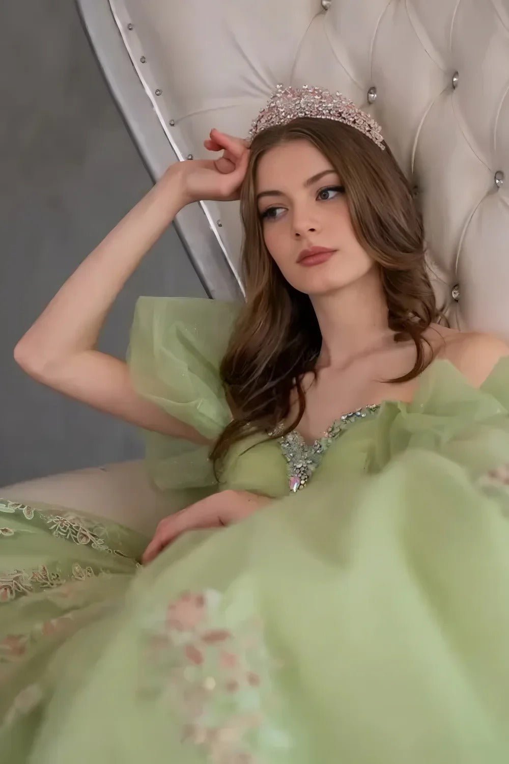 Lime quinceañera ball gown with illusion sweetheart bodice, corset boning, ruffled straps and floral embroidery