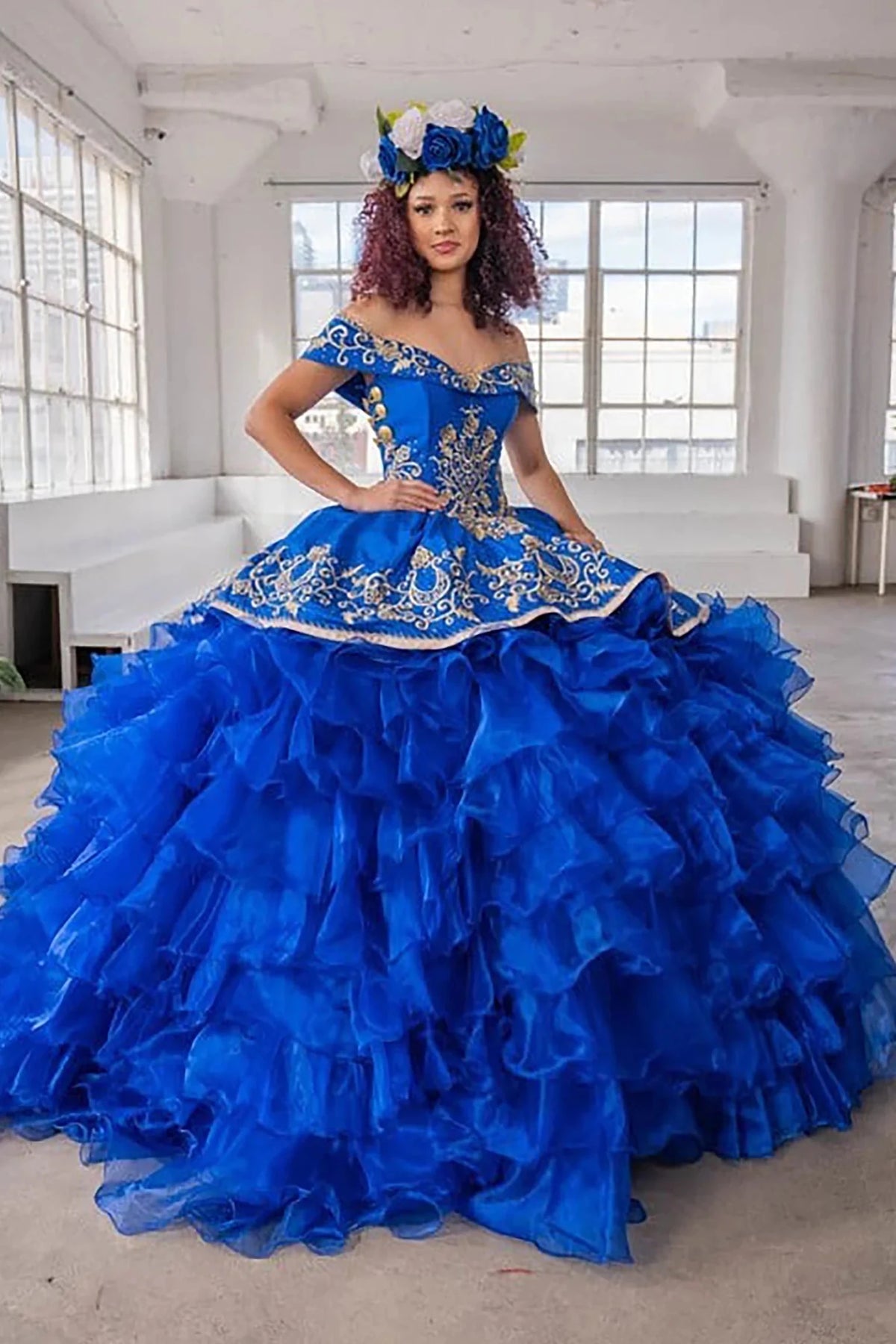 Royal blue quinceañera ball gown with gold embroidery, charra ruffle design and beaded bodice