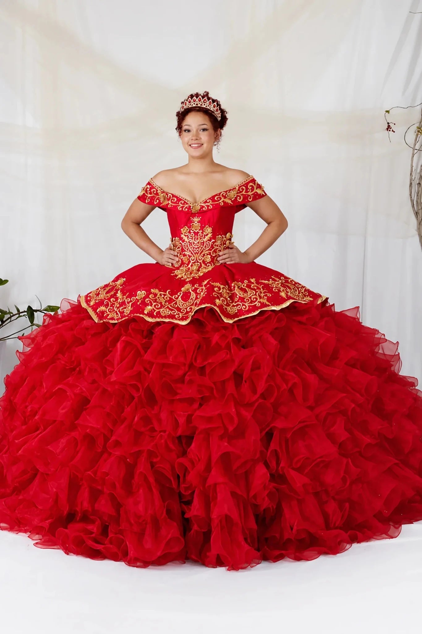 Red quinceañera ball gown with gold embroidery, charra ruffle design and beaded bodice