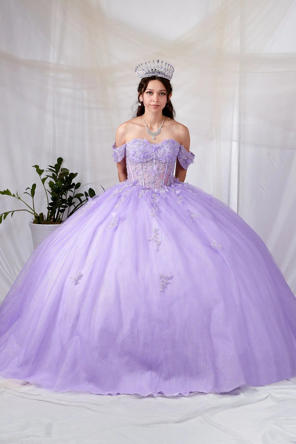 Lilac quinceañera ball gown with spaghetti straps, sheer bodice, 3D butterfly applique and layered lace skirt