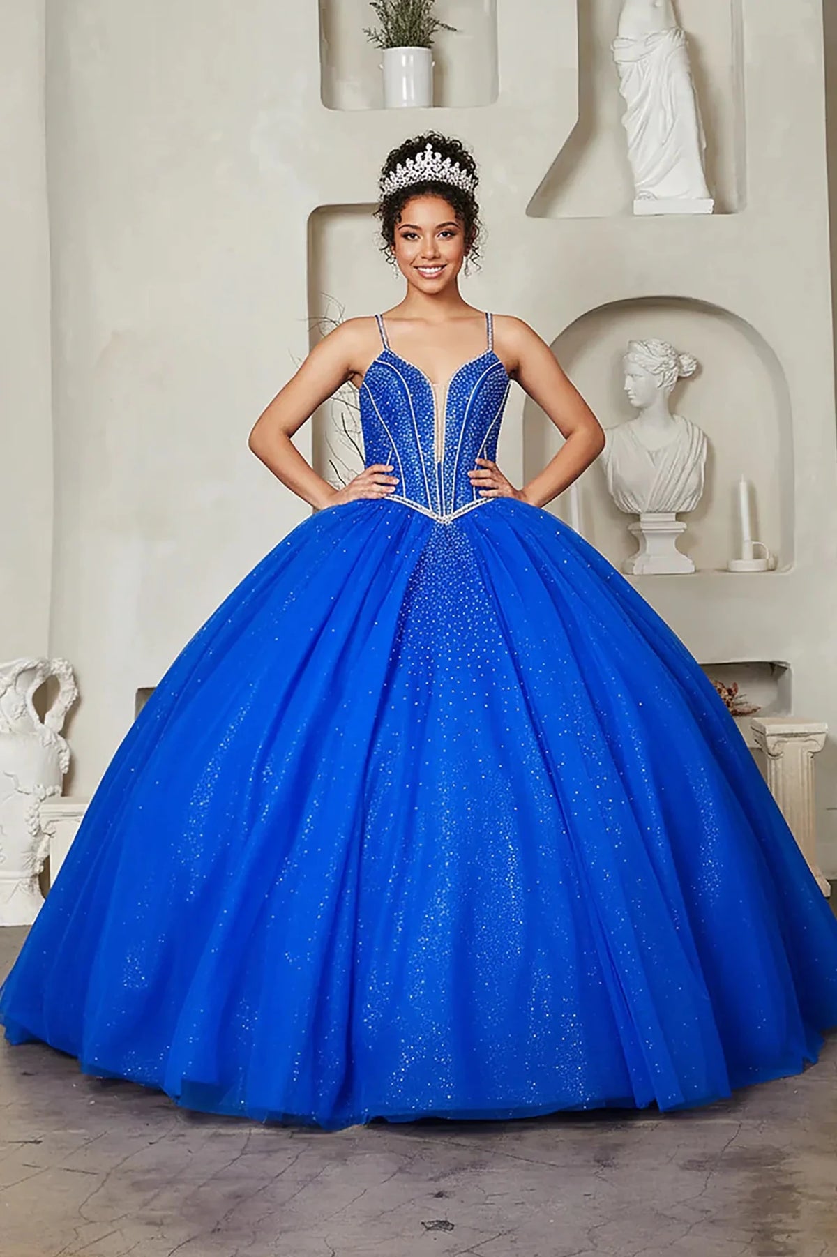 Royal blue quinceañera ball gown with crystal beaded bodice, embroidered details and glitter tulle skirt