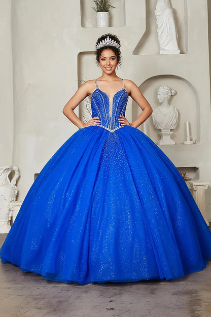 Bodice close-up highlights royal blue quinceañera ball gown with crystal beaded bodice, embroidered details and glitter tulle skirt.