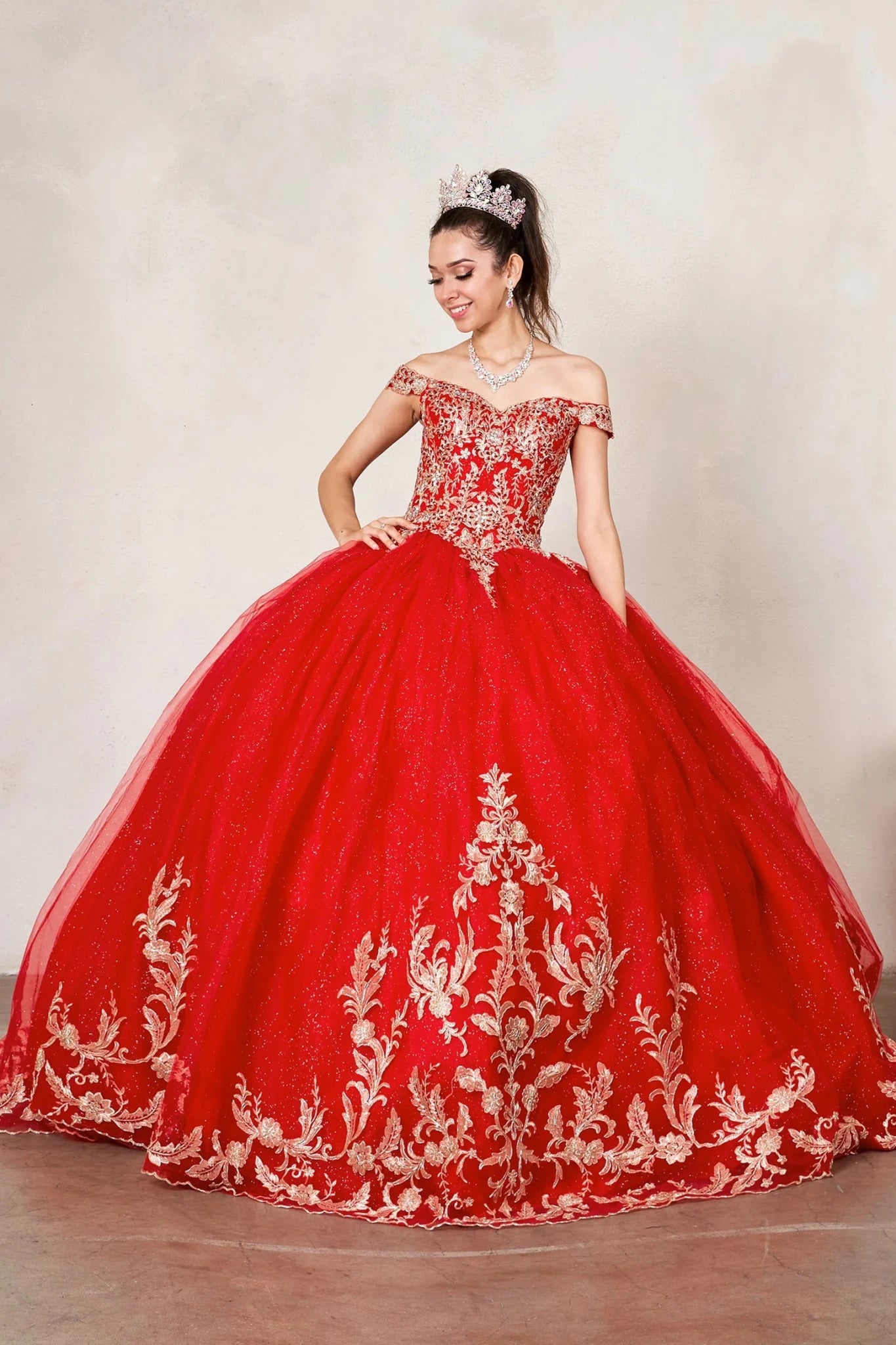 Red quinceañera ball gown with gold embroidered lace applique and glitter tulle overlay skirt