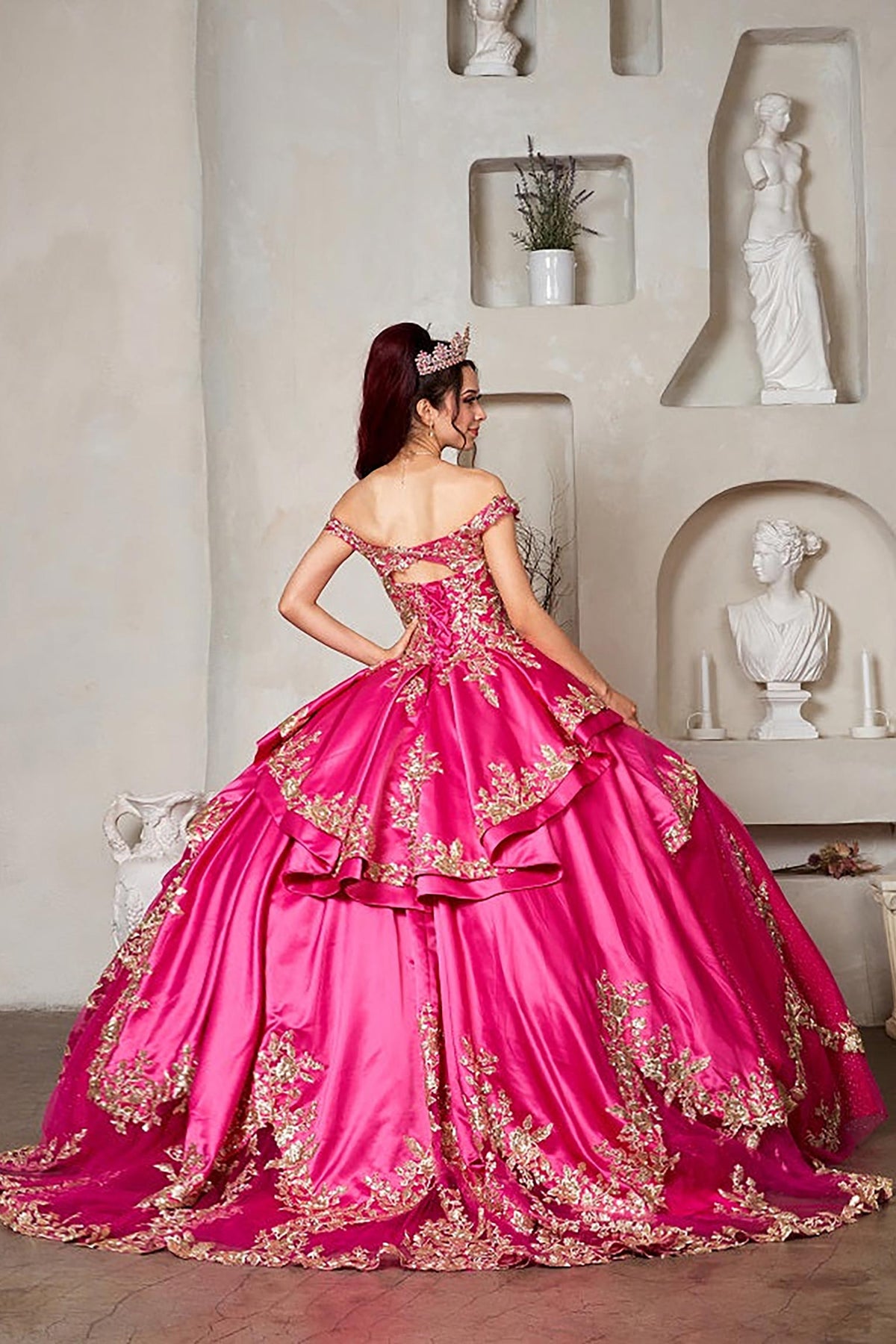 Fuchsia quinceañera ball gown with beaded glitter layered skirt, satin ruffle train and ornate embroidery