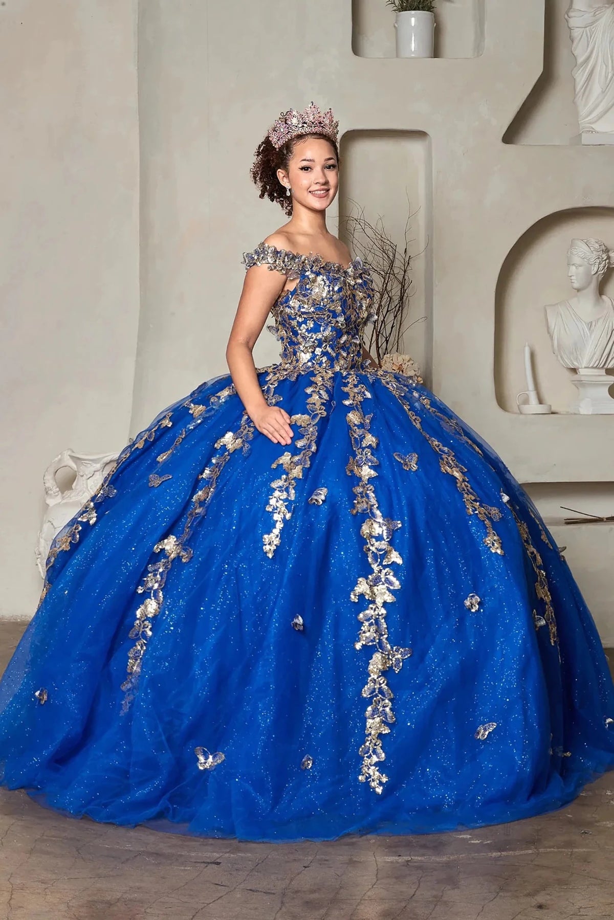 voluminous royal blue quinceañera dress with gold floral embroidery 