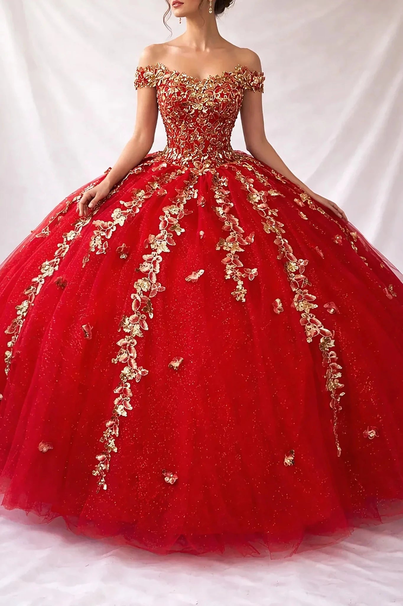 red quinceanera ball gown with gold floral embroidery over all