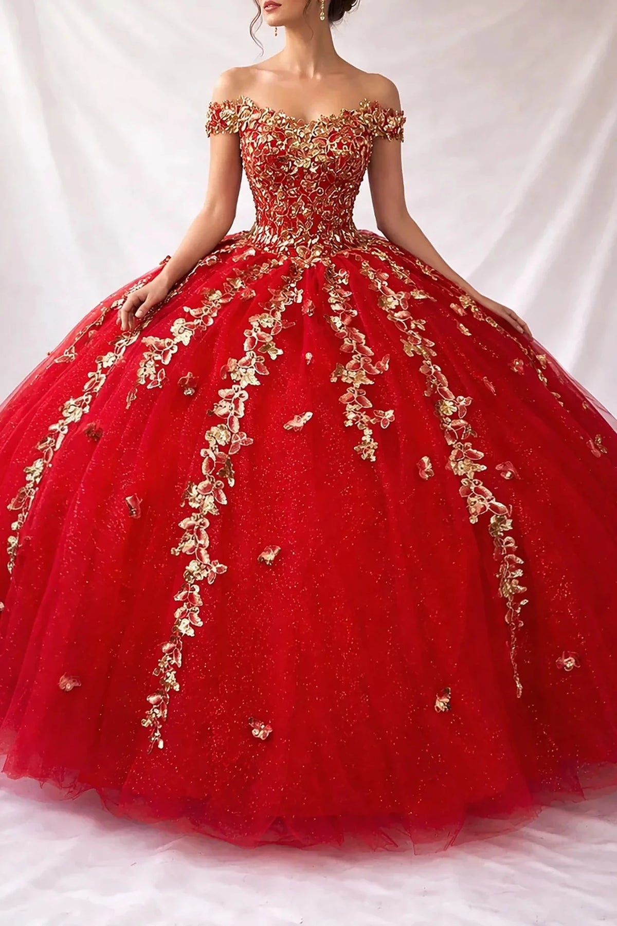 red quinceanera ball gown with gold floral embroidery over all