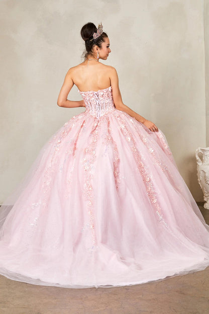 a strapless light pink ball gown with a full tulle skirt and floral lace appliqué